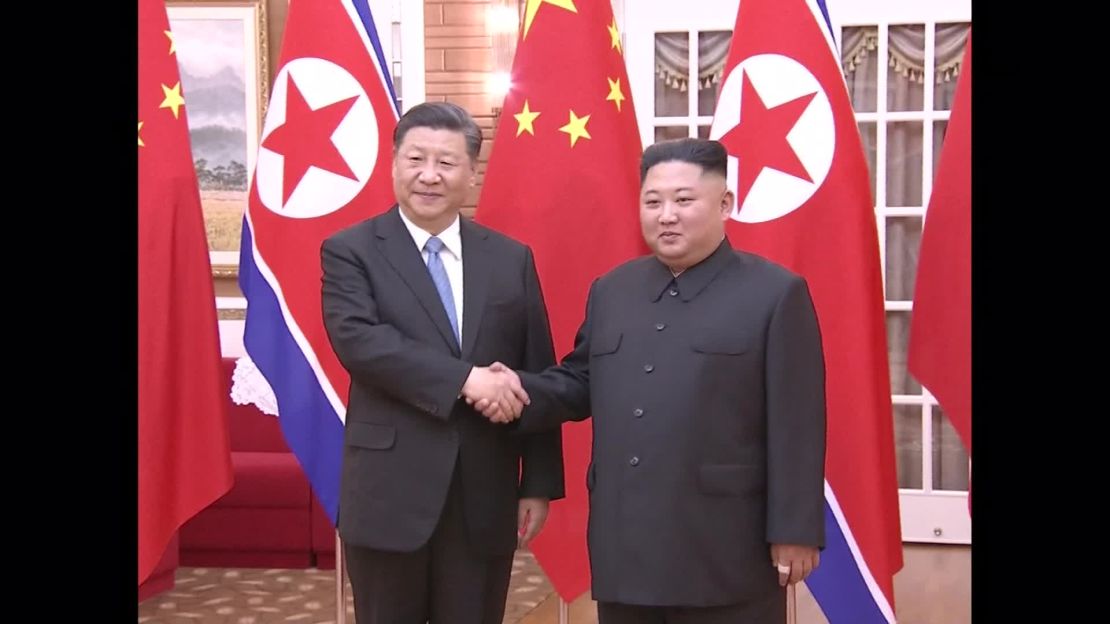 Xi (L) met Kim in North Korea on Thursday.