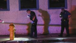 Police look for evidence early Thursday, June 20, 2019, in Allentown, Pa., following a shooting outside a nightclub.  The street shooting in eastern Pennsylvania that left 10 people wounded early Thursday is likely to be gang-related, authorities said. (Rich Rolen/The Morning Call via AP)