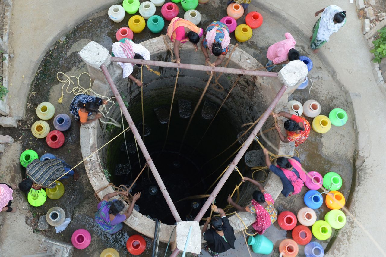 People fetch drinking water from a well in the outskirts of Chennai on May 29.