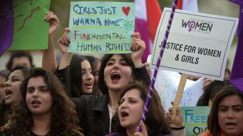 Pakistani civil society activists carry placards and shout slogans during a rally for women rights on International Women's Day in Islamabad on March 8, 2019.