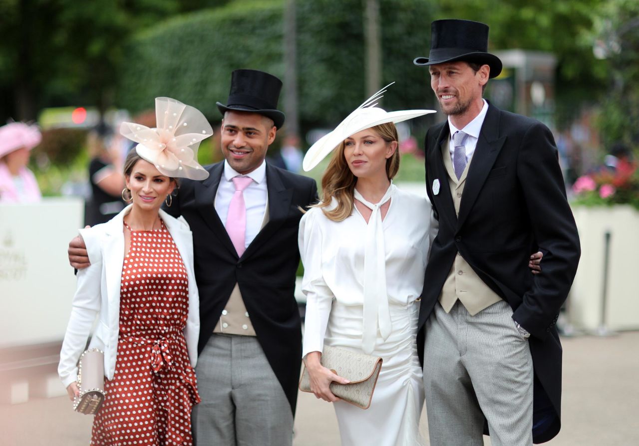 Premier League footballers Peter Crouch (right) and Glen Johnson with their wives on Ladies' Day.