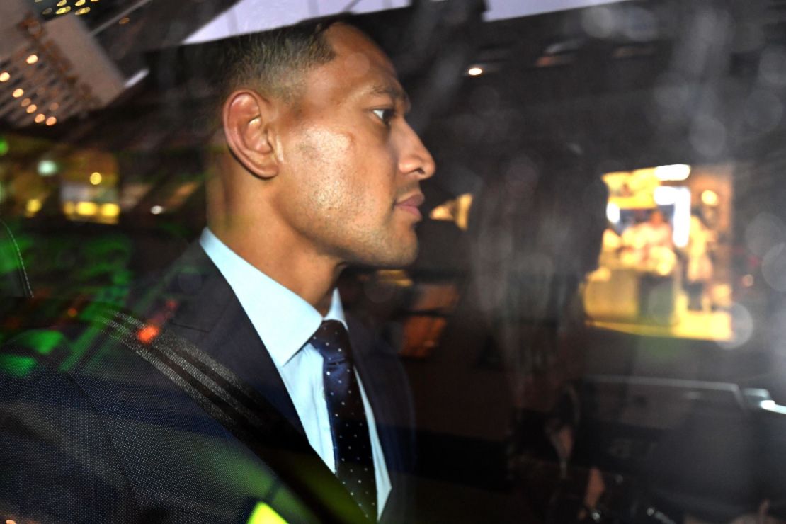 Folau leaves after a code of conduct hearing in Sydney.