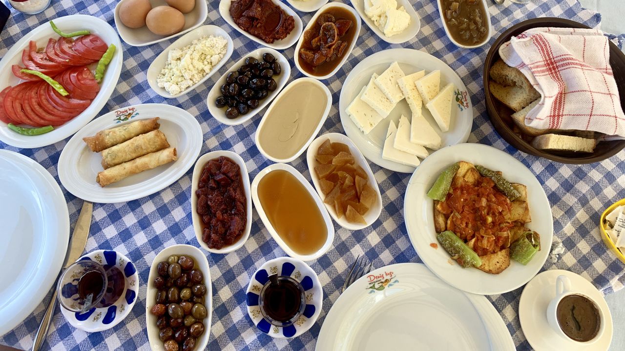A lavish spread of cheeses, olives, sausage, honey and jams served with cucumber, tomato and fluffy bread to be dipped and slathered in any combination you choose is a traditional Turkish breakfast.