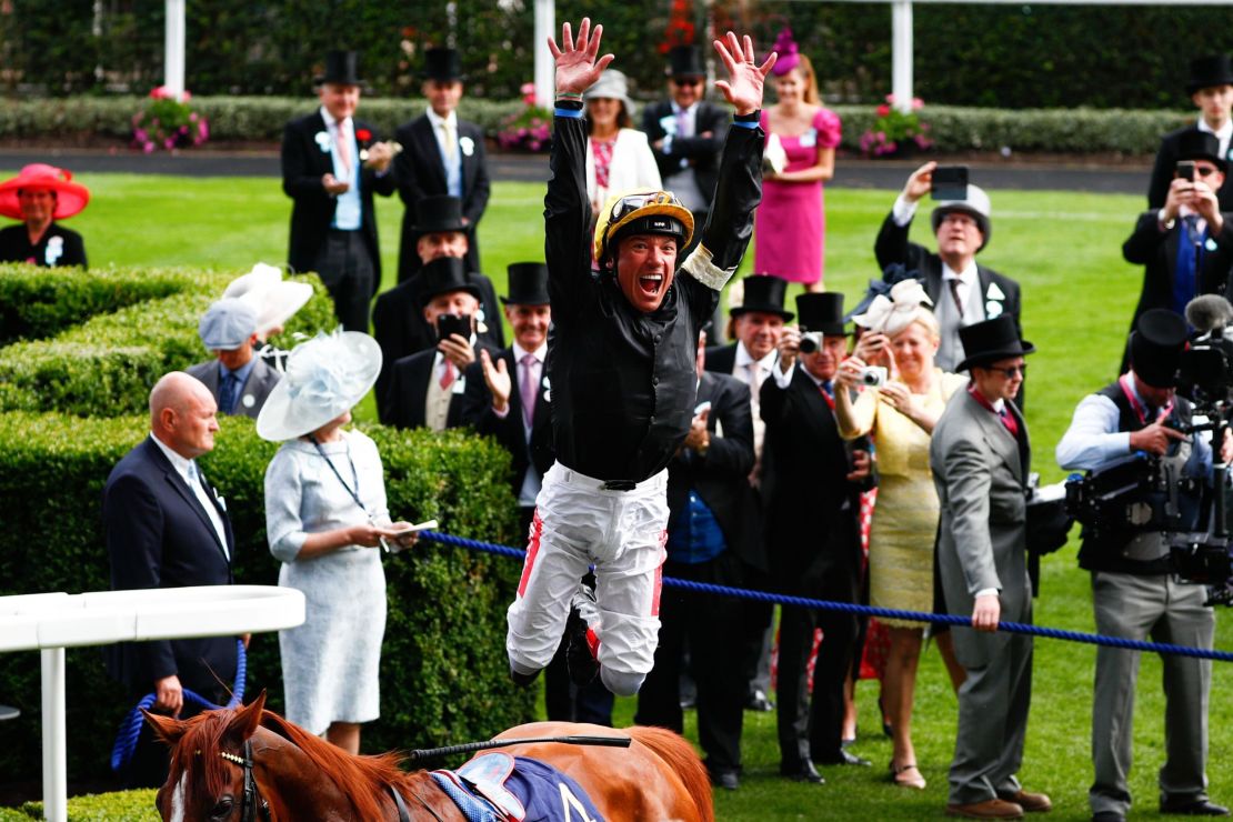 Dettori performs his trademark flying dismount after winning the Gold Cup. 