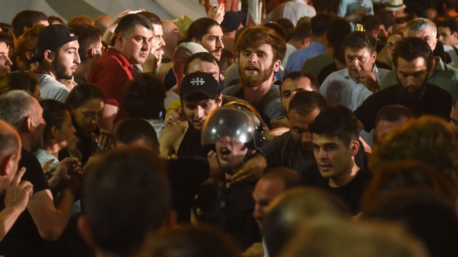People rally outside the parliament in Tbilisi on June 20, 2019. 