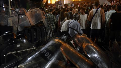 Georgian police used tear gas to disperse thousands of protesters attempting to storm the country's parliament.