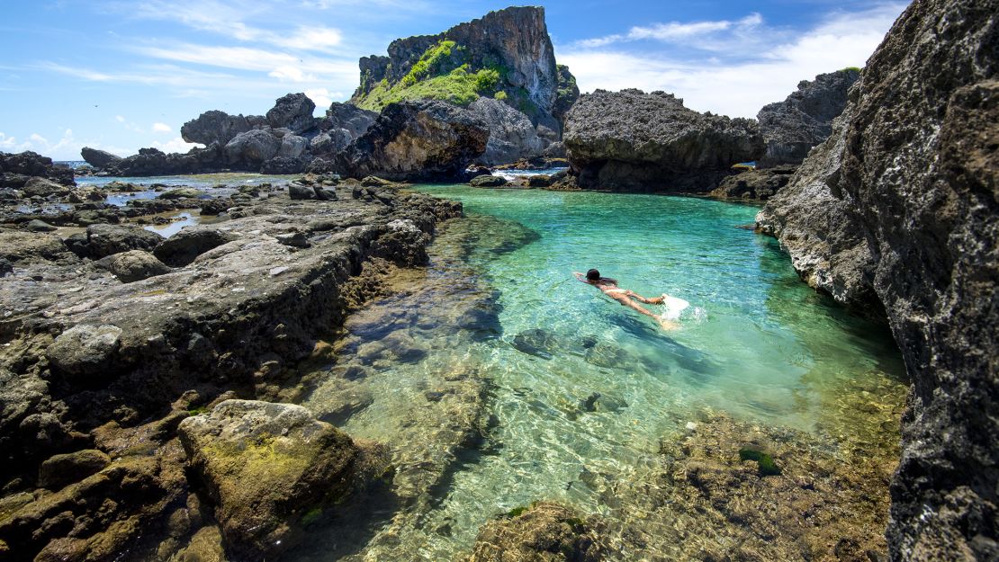 In the Northern Mariana Islands,  clear water and craggy rocks define Saipan's gorgeous shoreline.
