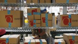 A worker places packages on shelves at the Overstock.com Inc. fulfillment center in Salt Lake City, Utah, U.S., on Wednesday, Aug. 8, 2018. The U.S. Census Bureau is scheduled to release wholesalers inventories figures on August 28. Photographer: Daniel Carde/Bloomberg via Getty Images