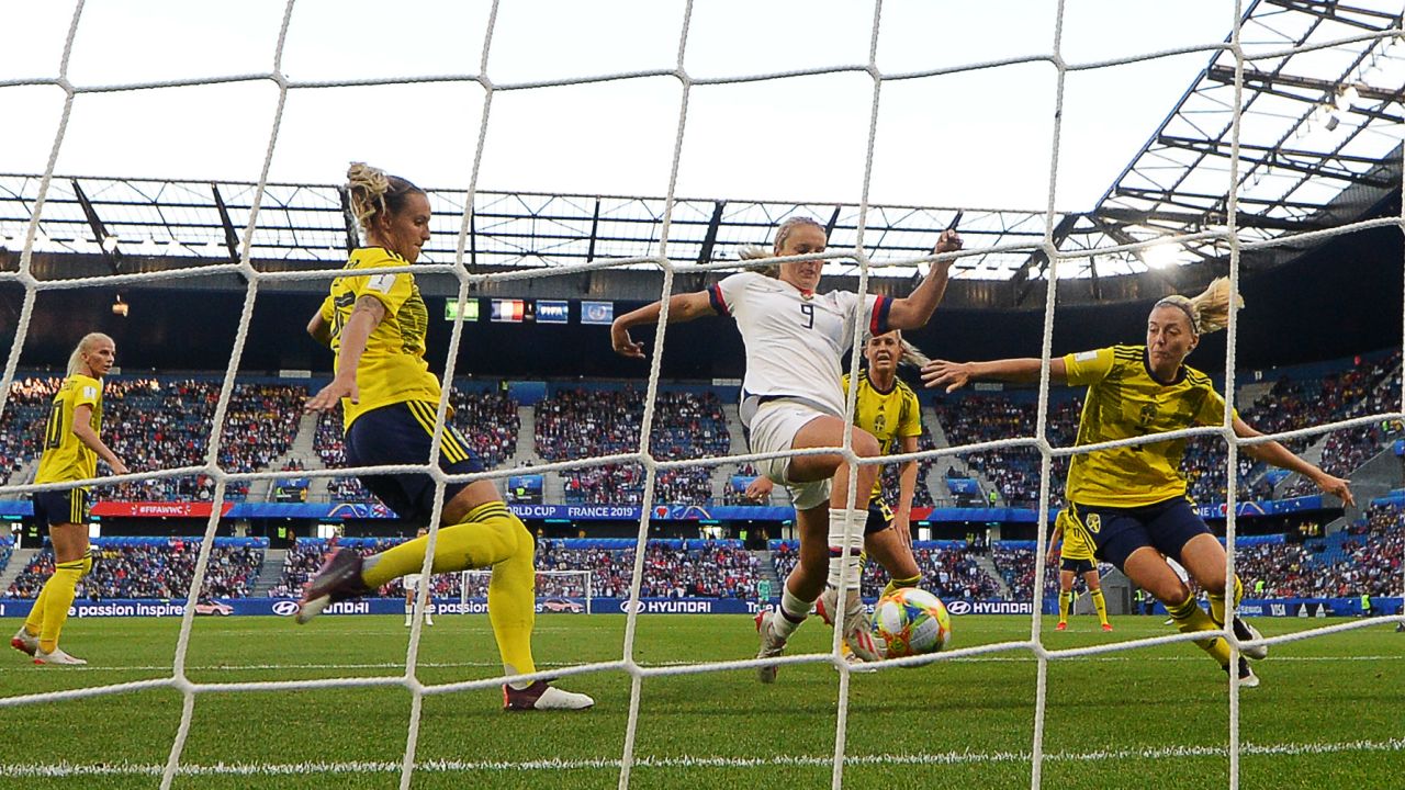 Horan (C) scores the opening goal against Sweden.