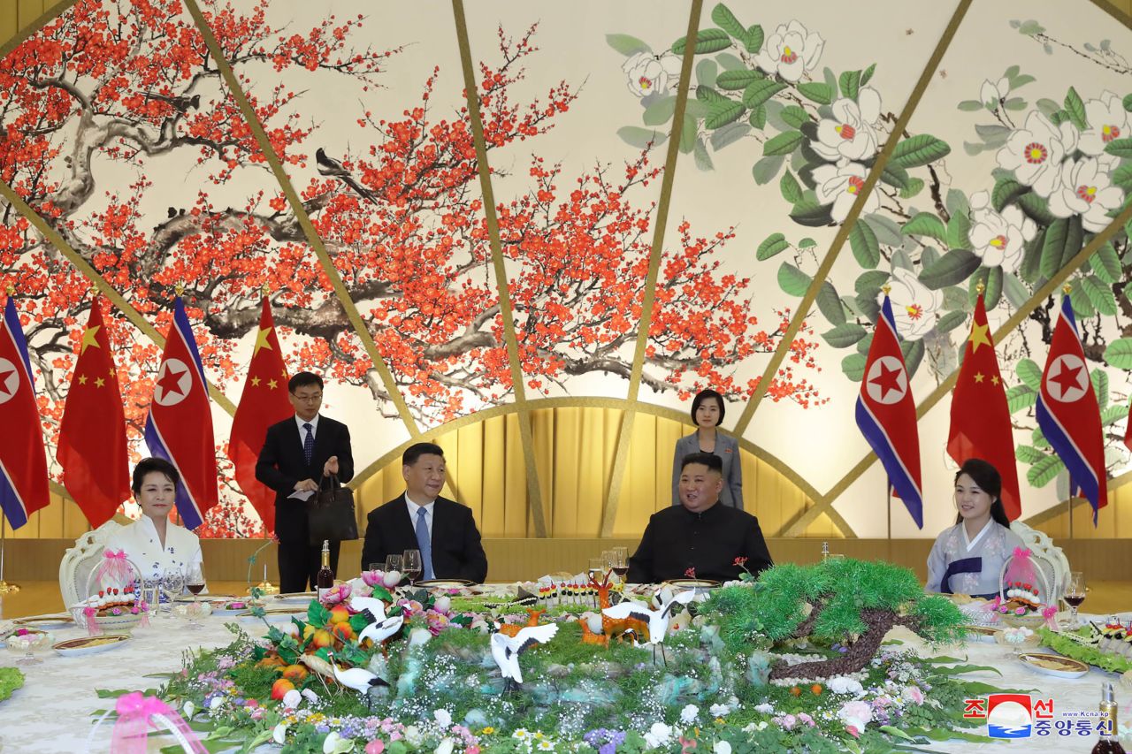 Kim, center right, his wife Ri Sol Ju, right, Xi Jinping, center left, and his wife Peng Liyuan attend at a banquet in Pyongyang, North Korea.