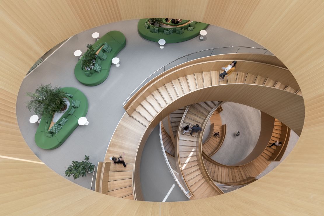 The building's staircases are inspired by the five Olympic rings, designers say.