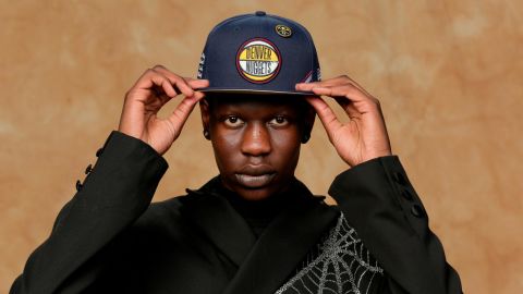 Bol Bol poses for a portrait in a Denver Nuggets hat.
