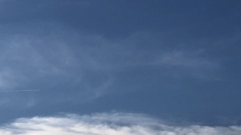You may have to squint, but the two small white spheres seen high in the sky above Kansas City are visible in this photo tweeted out by the National Weather Service.