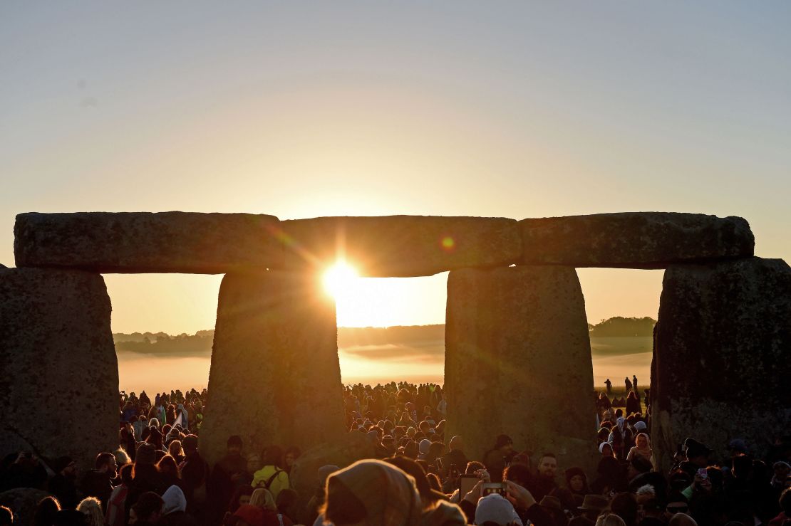 Visitors watch the summer solstice sunrise on Friday morning.