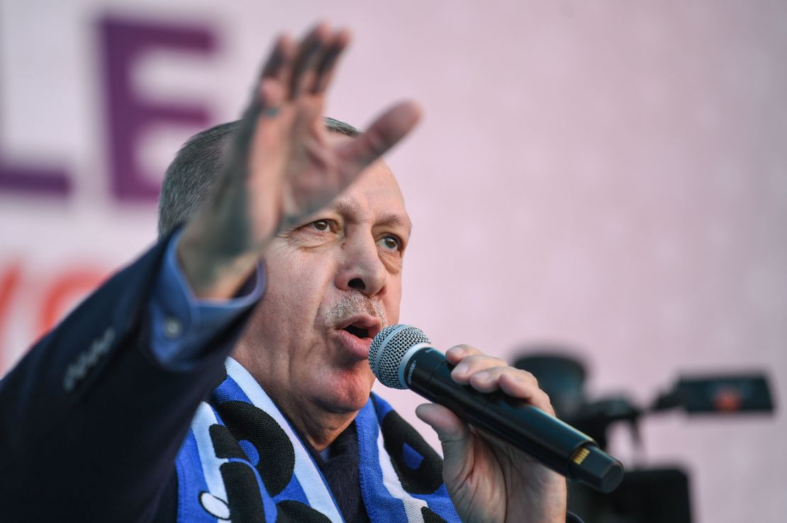 President Erdo?an sings at an AKP rally in Kas?mpa?a on March 5, ahead of the first vote.