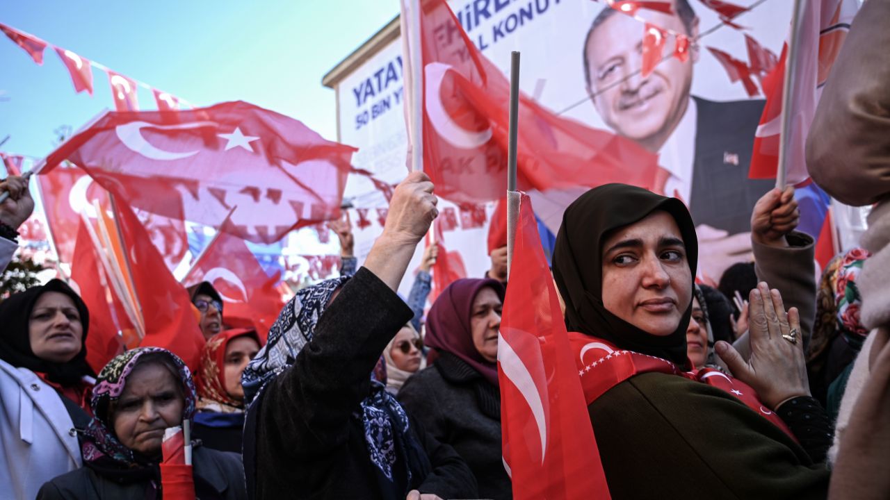 AKP supporters wave Turkish flags at a campaign rally in Kasımpaşa in March.