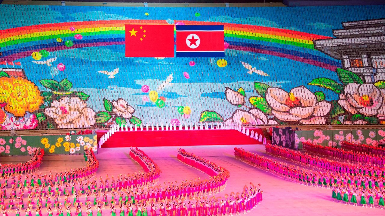 Chinese and North Korean flags are displayed during a mass gymnastic performance at the May Day Stadium in Pyongyang, North Korea.