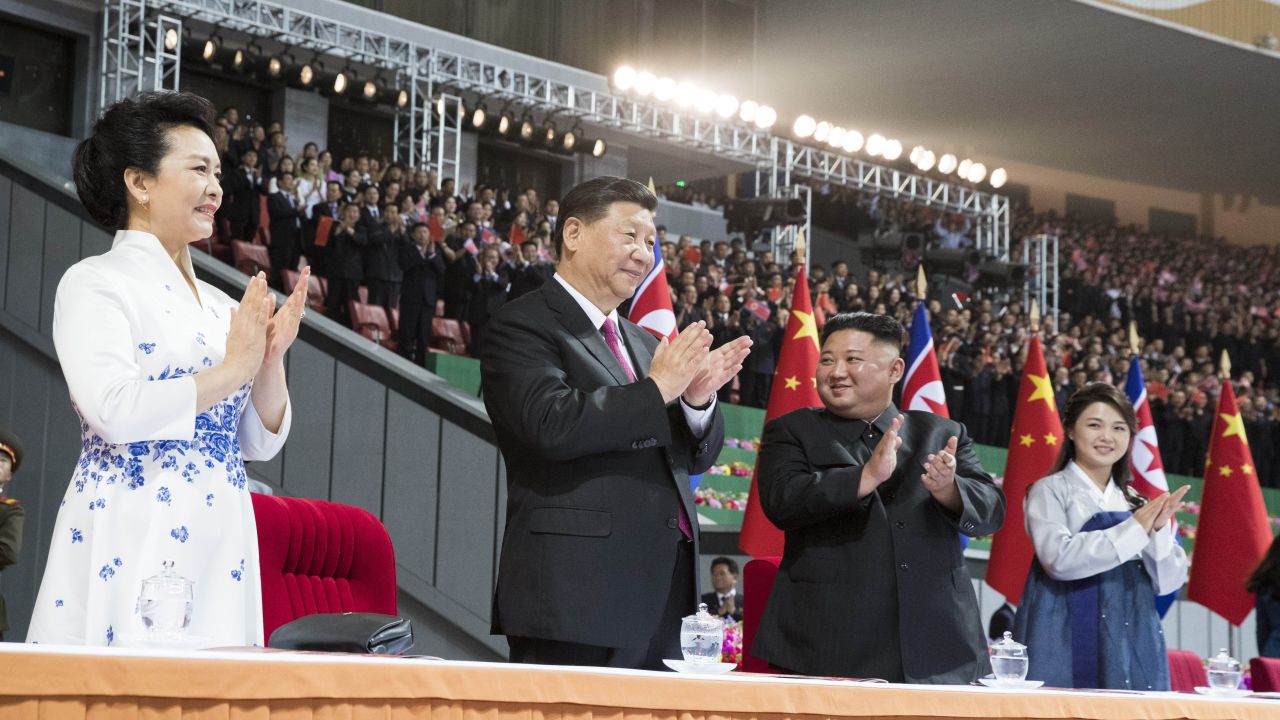 Xi Jinping, second from left, and his wife Peng Liyuan, left, and Kim Jong Un, second from right, and his wife Ri Sol Ju, right, in Pyongyang, North Korea.