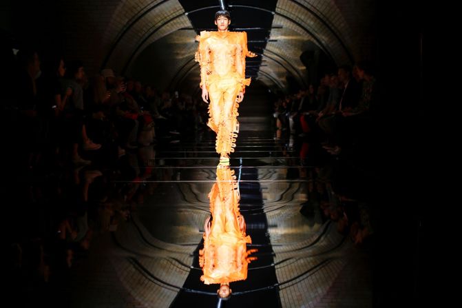 A model presents creations during the Craig Green catwalk at London Fashion Week Men's on June 10, 2019. 
