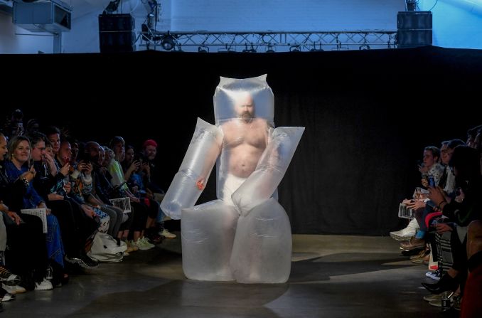 A model showcases designs by San Kim on the runway at the University of Westminster MA Menswear show during London Fashion Week Men's at the Oval Space on June 09, 2019. 