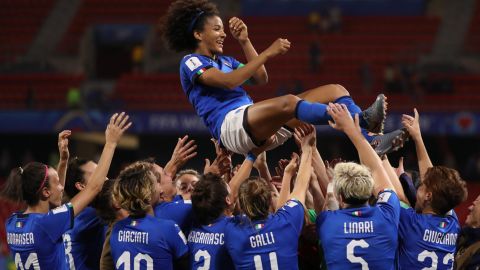 Sara Gama of Italy is thrown in the air by her teammates.