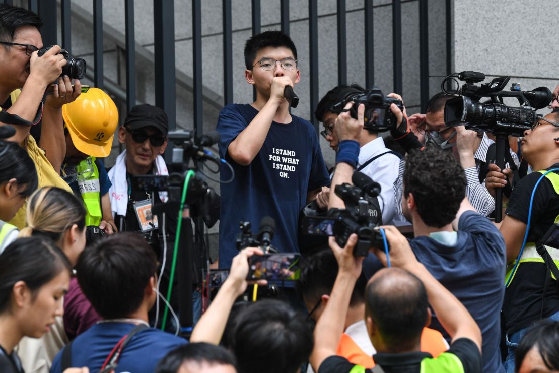Pro-democracy activist Joshua Wong speaks to protesters outside the police headquarters in Hong Kong on June 21, 2019.