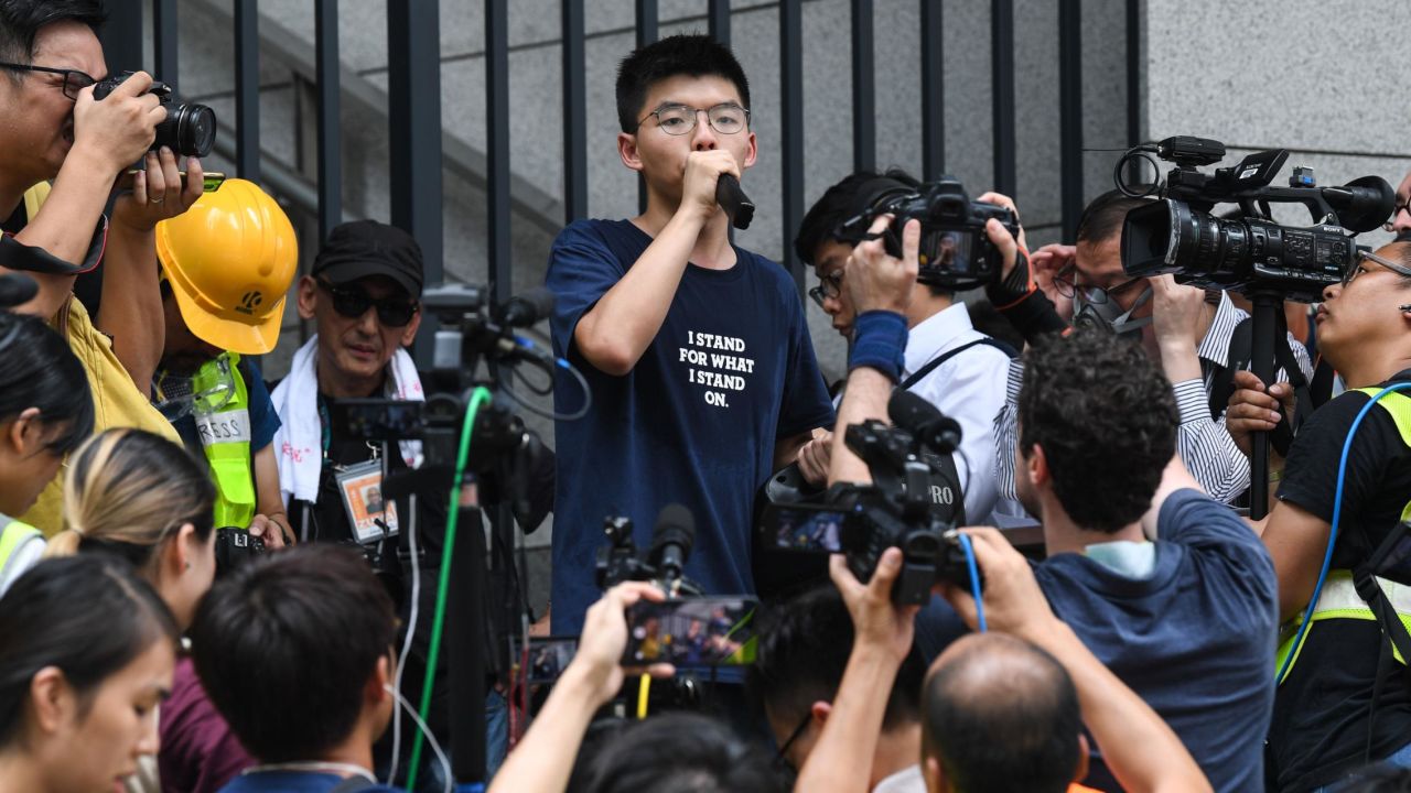 Pro-democracy activist Joshua Wong speaks to protesters outside the police headquarters in Hong Kong on June 21, 2019.
