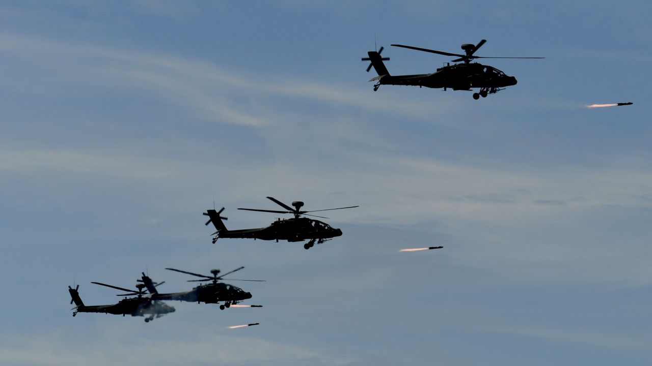 Four US-made Apache attack helicopters launch missiles during the 35th "Han Kuang" military drill in southern Taiwan on May 30.