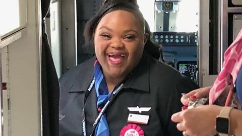 Shantell "Princess" Pooser smiles wide as she became an honorary American Airlines flight attendant. 