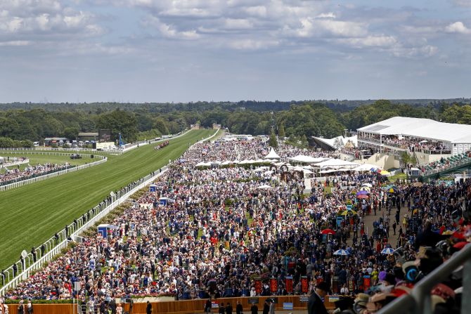 Huge crowds once again pack the historic race course in Berkshire, west of London.