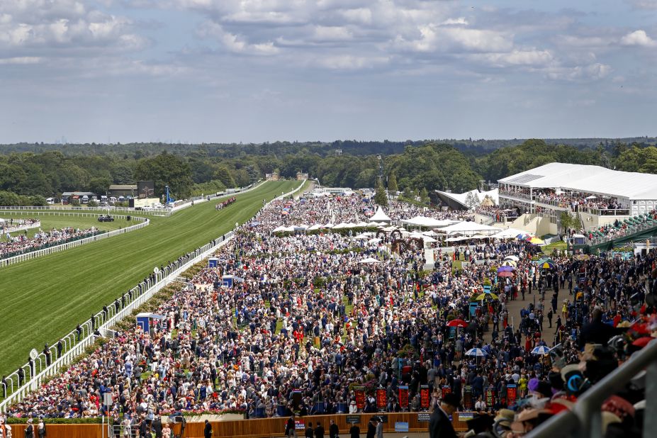 Huge crowds once again pack the historic race course in Berkshire, west of London.  