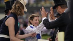 ASCOT, ENGLAND - JUNE 21: ITV Racing greet a delighted Hayley Turner after she rides Thanks Be to win The Sandringham Stakes to become the first female rider to ride a winner at the Royal meeting in 32 years, on day four of Royal Ascot at Ascot Racecourse on June 21, 2019 in Ascot, England. (Photo by Alan Crowhurst/Getty Images for Ascot Racecourse )