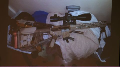 Officers found two assault rifles, a handgun and a shot gun in the main home as well as two weapons in the adjacent house.