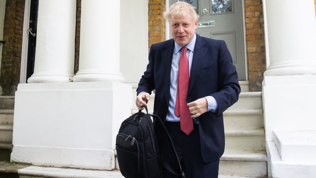 Boris Johnson leaves his home in south London on Friday after he emerged as the front-runner in the leadership race.