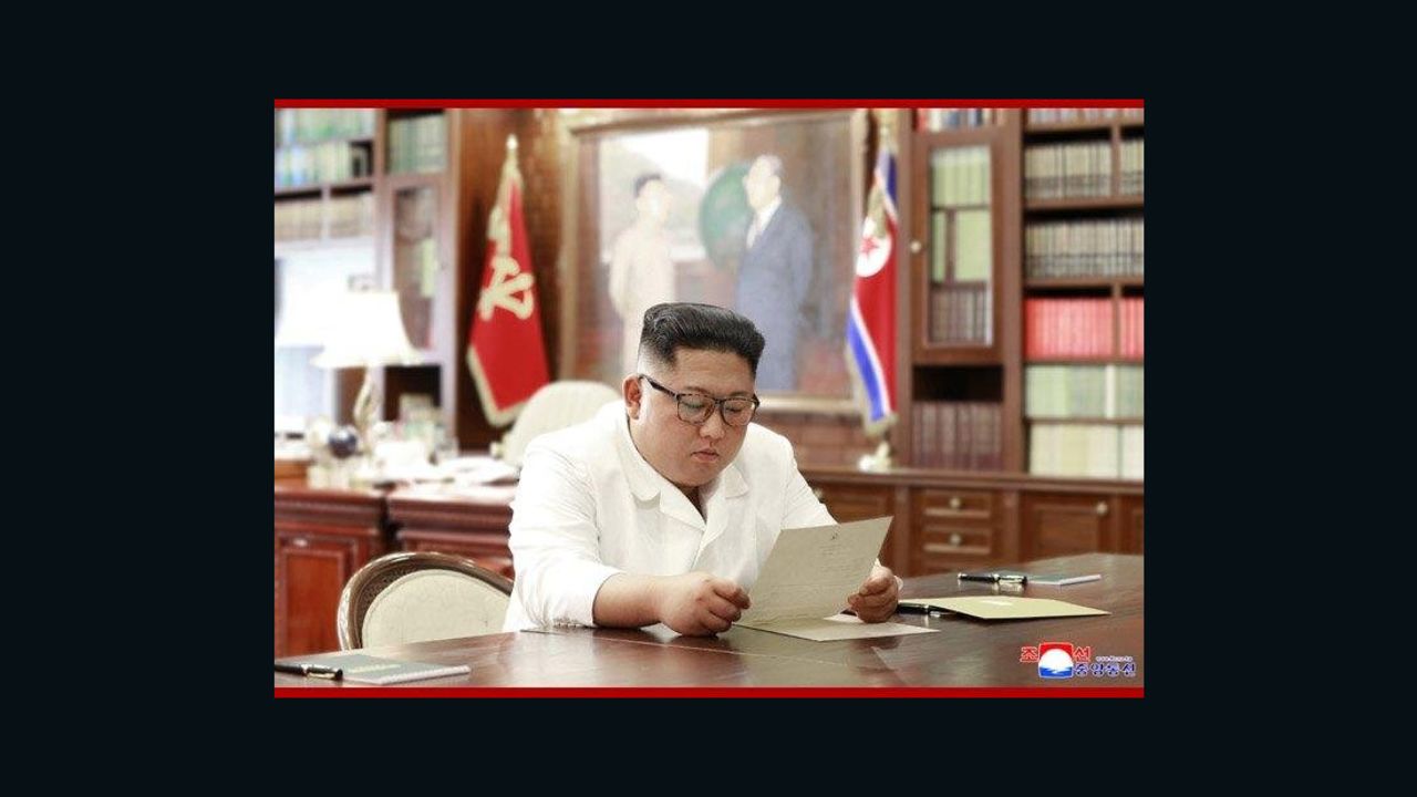 In this undated photo provided on Sunday, June 23, 2019, by the North Korean government, North Korean leader Kim Jong Un reads a letter from U.S. President Donald Trump. Independent journalists were not given access to cover the event depicted in this image distributed by the North Korean government. The content of this image is as provided and cannot be independently verified. Korean language watermark on image as provided by source reads: "KCNA" which is the abbreviation for Korean Central News Agency.