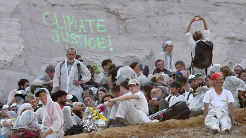Hundreds of climate change activists staged a blockade in one of Germany's largest coal mines to protest against the country's ongoing dependence on fossil fuels.