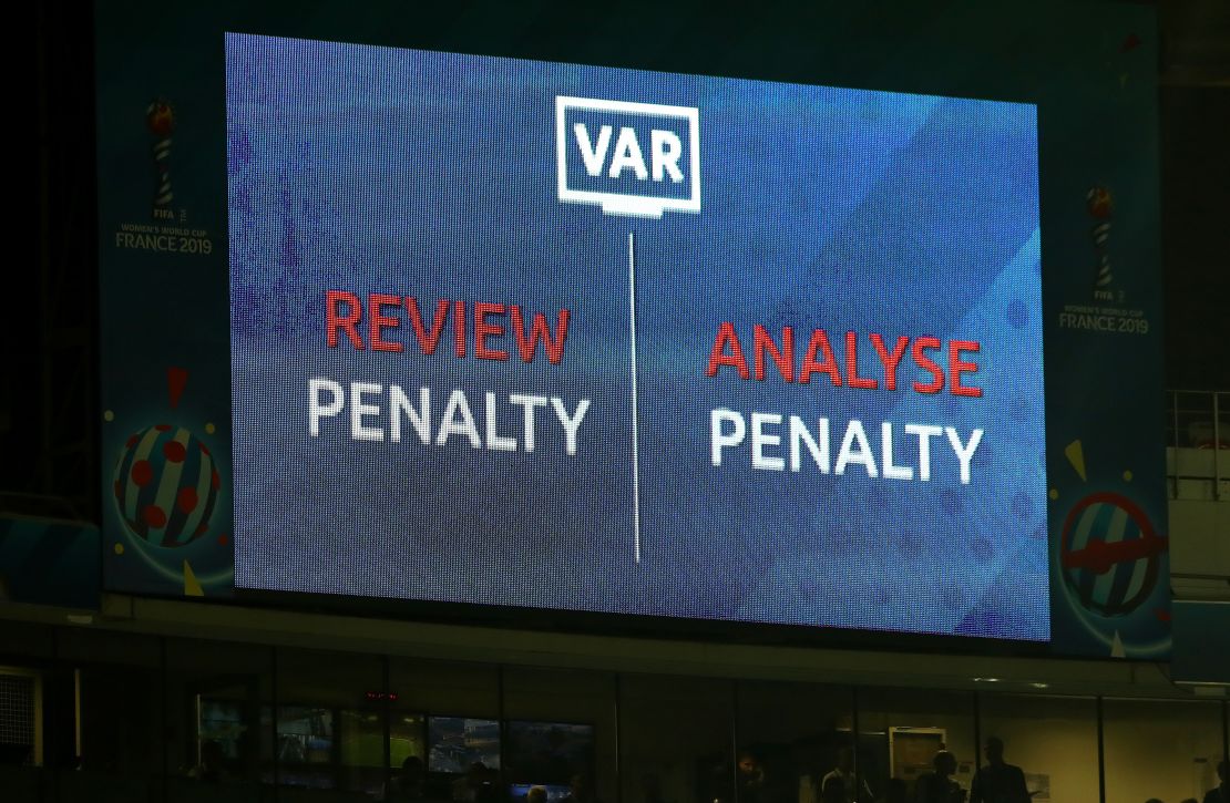 An LED screen shows a VAR review is in place over a penalty decision at the Women's World Cup.