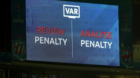 An LED screen shows a VAR review is in place over a penalty decision at the Women's World Cup.