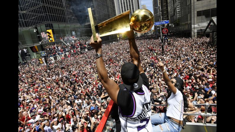 Toronto Raptors guard Kyle Lowry holds the Larry O'Brien Trophy during the team's NBA Championship victory parade in Toronto, Canada on Monday, June 17. On June 14, <a href="index.php?page=&url=https%3A%2F%2Fwww.cnn.com%2F2019%2F06%2F13%2Fsport%2Fgallery%2Fnba-finals-2019%2Findex.html" target="_blank">the Raptors claimed their first ever NBA title</a>, defeating the Golden State Warriors in six games.