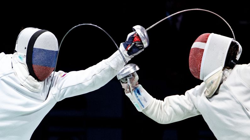 Russia's Sergey Bida, left, and Denmark's Patrick Jorgensen hit each other almost simultaneously during the European Fencing Championships held in Düsseldorf, Germany, on Friday, June 21.