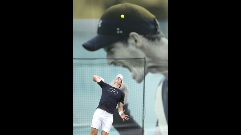 Andy Murray serves a ball during a practice session ahead of his doubles match on Day 4 of the Fever-Tree Championship at the Queen's Club in London on June 20.