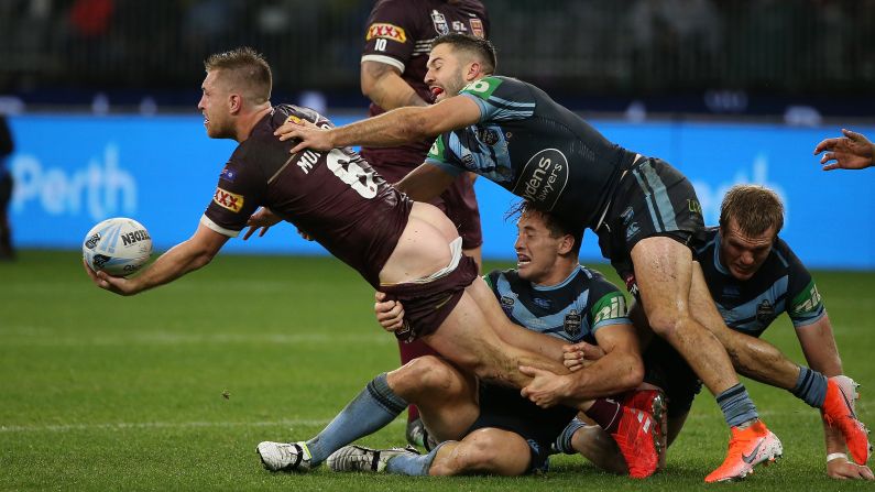 Cameron Munster of Queensland has his shorts pulled down while being tackled during Game 2 of the State of Origin series between the New South Wales Blues and the Queensland Maroons at Optus Stadium in Perth, Australia on June 23. <a href="index.php?page=&url=https%3A%2F%2Fwww.cnn.com%2F2019%2F06%2F16%2Fsport%2Fgallery%2Fwhat-a-shot-sports-0616%2Findex.html" target="_blank">See 37 sports photos from last week</a>