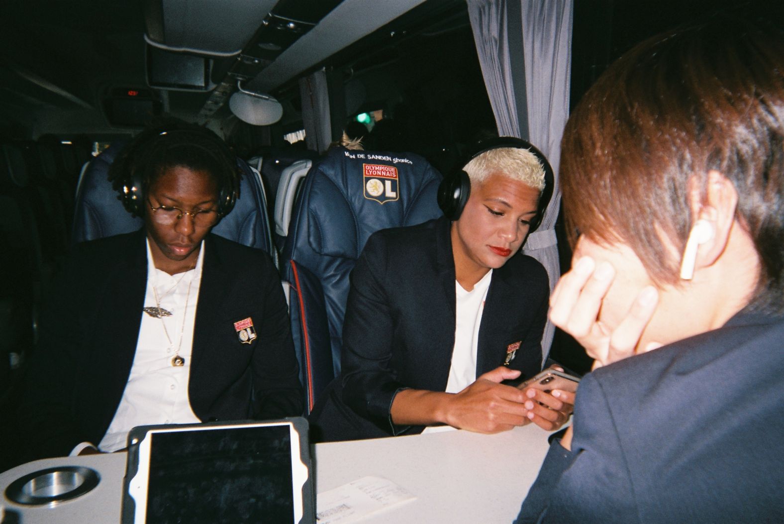 <strong>Photographer:</strong> Lucy Bronze, England & Lyon (in partnership with UEFA #WePlayStrong)<br /><strong>Location:</strong> Lyon, France<br /><br />"This was match day, en route to the Champions League semi-final second leg. We have our match day suits on, only to be worn for big occasions and big games. Shanice and Keisha are listening to their own music, but Saki and me are watching the other semi final, Barca v Bayern. Saki and I sit to each other in the changing rooms and on the bus. She's the best person to sit next to because she always has some sort of Japanese sweets and treats, so she's always feeding me something! She doesn't speak English that well and I don't speak French that great. But we chat all the time in a mix of the two languages and I've learnt some Japanese words too, so every morning we say good morning in Japanese."