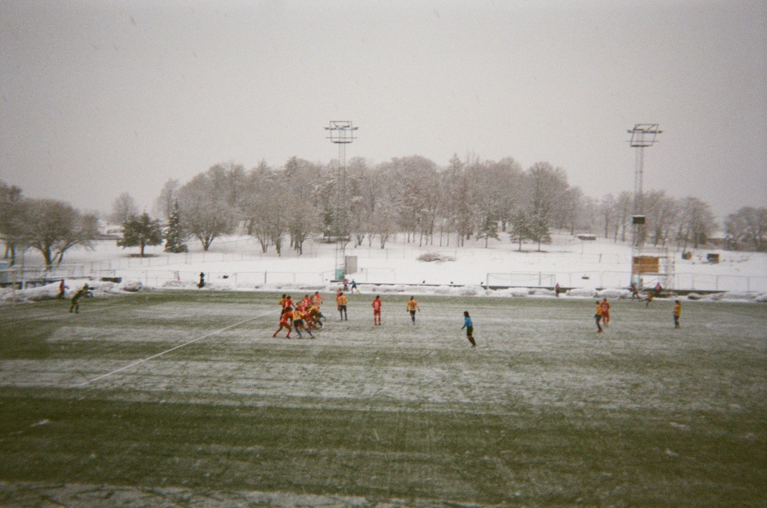 <strong>Photographer:</strong> Lauren Silver, Jamaica & Trondheims-?rn<br /><strong>Location: </strong>Trondheim, Norway<br /><br />"My team Trondheims-?rn was playing against another top division Norwegian team. That week it had been snowing intensely and it sure didn't stop for the game. I couldn't play this game because my paperwork for the team was not complete. So I was sitting in the stands watching. Practicing and playing in the snow is really hard. Everything is cold and my toes always go numb, plus the ground is really slippery because the ice melts, then freezes on the ground. If you look in the background, you can see pile on piles of snow. My team was fighting hard and we came out with a 0-0 tie. These photos show one side of Norway. Some days it is very nice, especially during spring. But during the winter, the snow definitely comes in waves. It's cool that football takes me to places like Norway. Sometimes I take a step back to really remember and appreciate that."