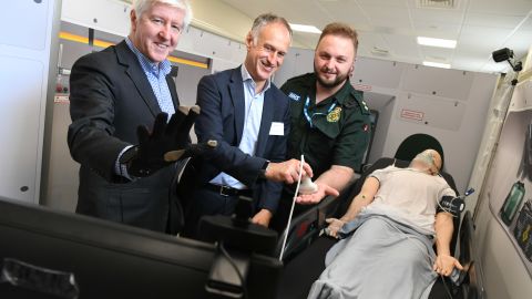Executives from telecom company BT and a  member of the West Midlands Ambulance Service trial the 5G technology.