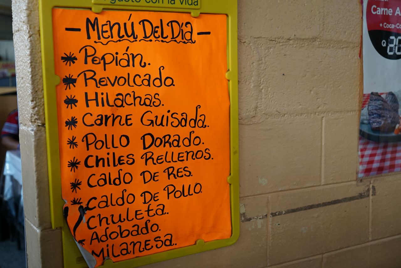 <strong>The day's offerings: </strong>A poster advertises the menu of the day at the covered section of Antigua's El Mercado. A meal can be had for as little as $1.