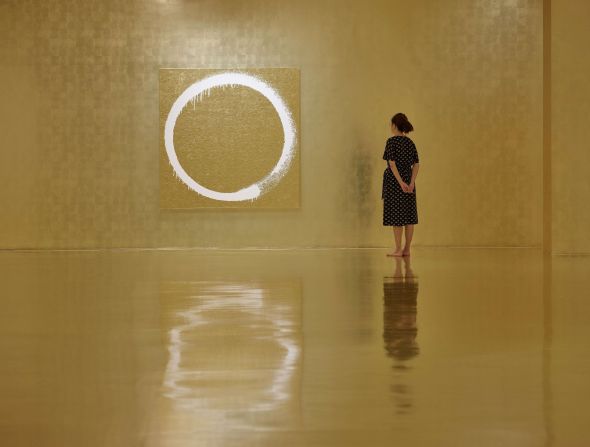A room drenched in gold from floor to ceiling. The circle motif in this painting, "Ensō: Shangri" -- "Enso" literally means "circle" -- symbolizes emptiness, unity and infinity in Zen Buddhism.