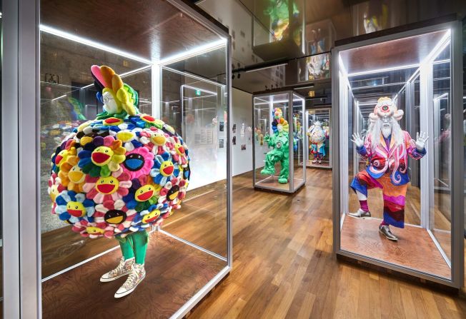 Murakami regularly appears at his own exhibition openings wearing his outlandish designs, which often feature multi-colored furs, gleaming sparkles, and matching headgear. 