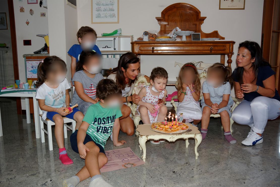 When it came to celebrating birthdays, Angela's friends had to wear masks to help keep her safe. CNN has blurred the faces of other children in the photo to protect their privacy.