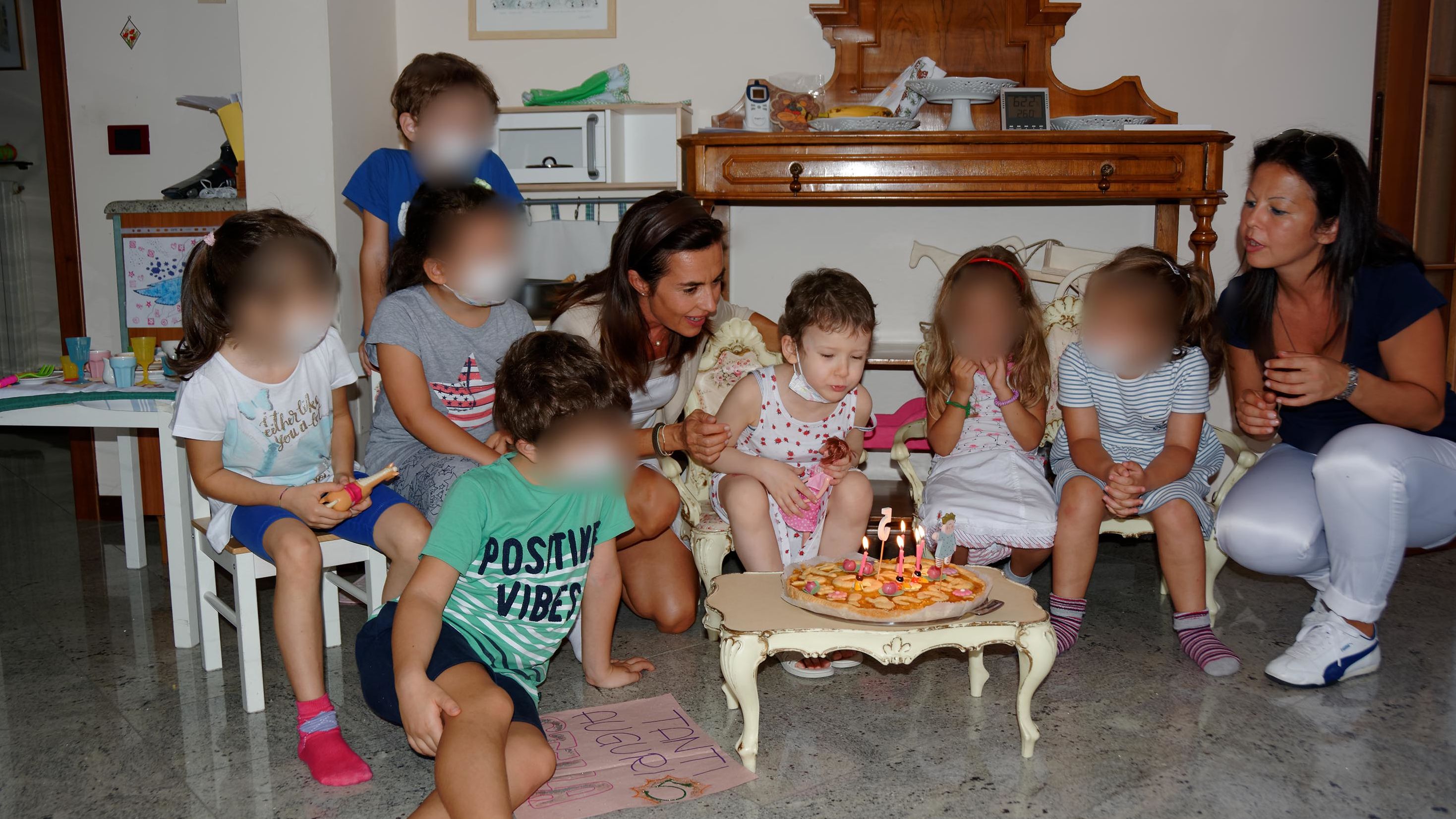 When it came to celebrating birthdays, Angela's friends had to wear masks to help keep her safe. CNN has blurred the faces of other children in the photo to protect their privacy.